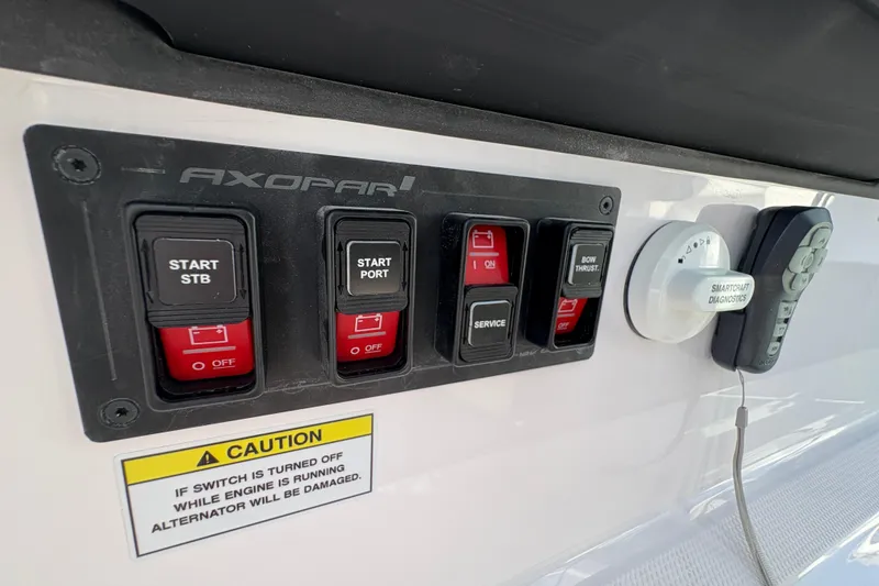 Slide: The Image of Control panel of 2025 Axopar 29 XC Cross Cabin with switches and diagnostic tools. - 55
