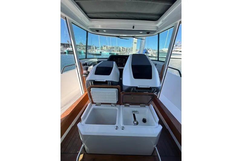 Slide: The Image of 2021 Axopar 28 Cabin BRABUS with wet bar, docked at marina. - 9