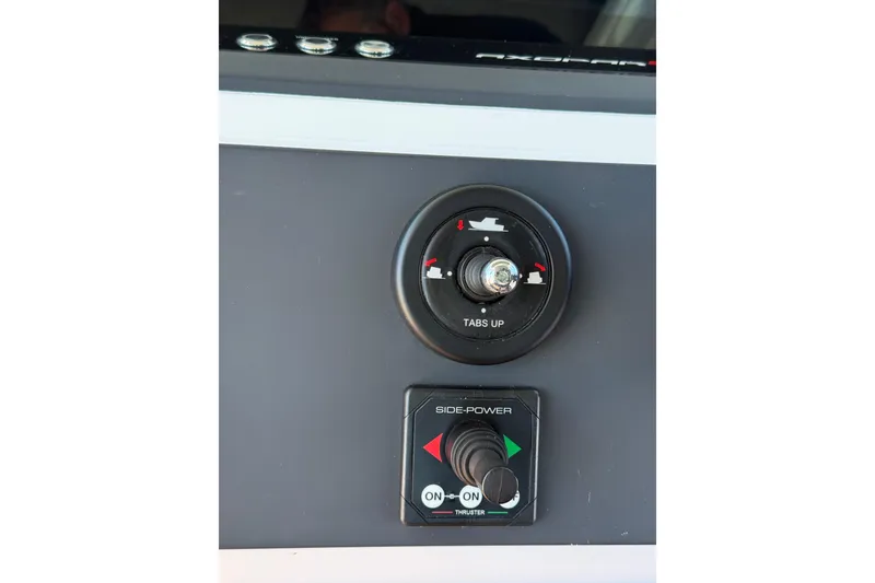 Slide: The Image of Control panel of 2021 Axopar 28 Cabin BRABUS Trim Wet Bar boat. - 11