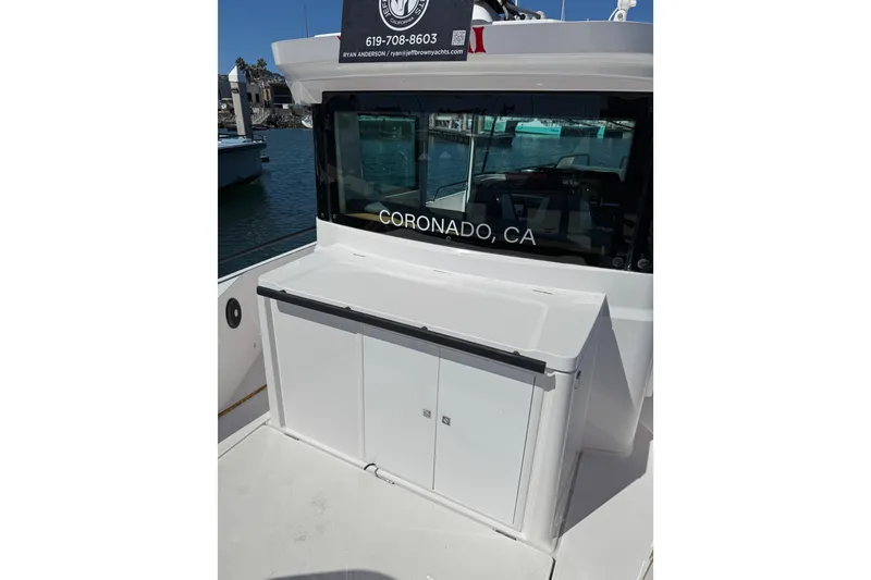 Slide: The Image of 2021 Axopar 28 Cabin BRABUS Trim with wet bar, docked in Coronado, CA. - 4
