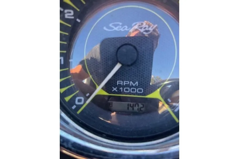 Slide: The Image of Close-up of 2018 Sea Ray 21 SPX OB tachometer showing 1472 RPM. - 11