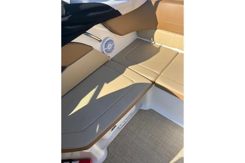 Slide: The Image of 2018 Sea Ray 21 SPX OB boat interior with tan seating and speaker. - 4