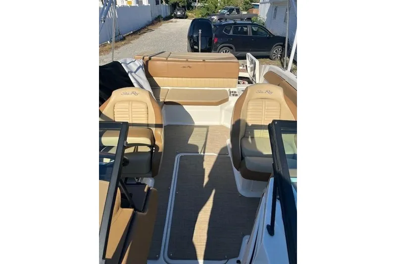 Slide: The Image of 2018 Sea Ray 21 SPX OB boat interior with tan seating and open deck layout. - 5