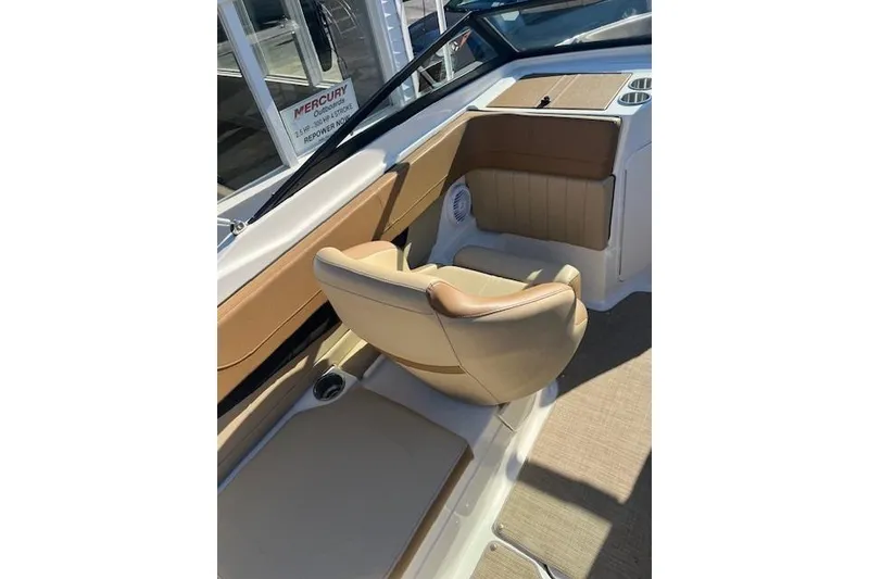 Slide: The Image of 2018 Sea Ray 21 SPX OB boat interior with tan seating and console. - 7
