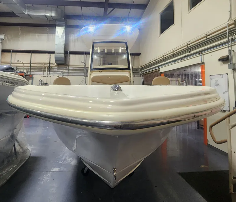 Slide: The Image of Scout 215 XSF 2023 boat in a storage facility. - 13