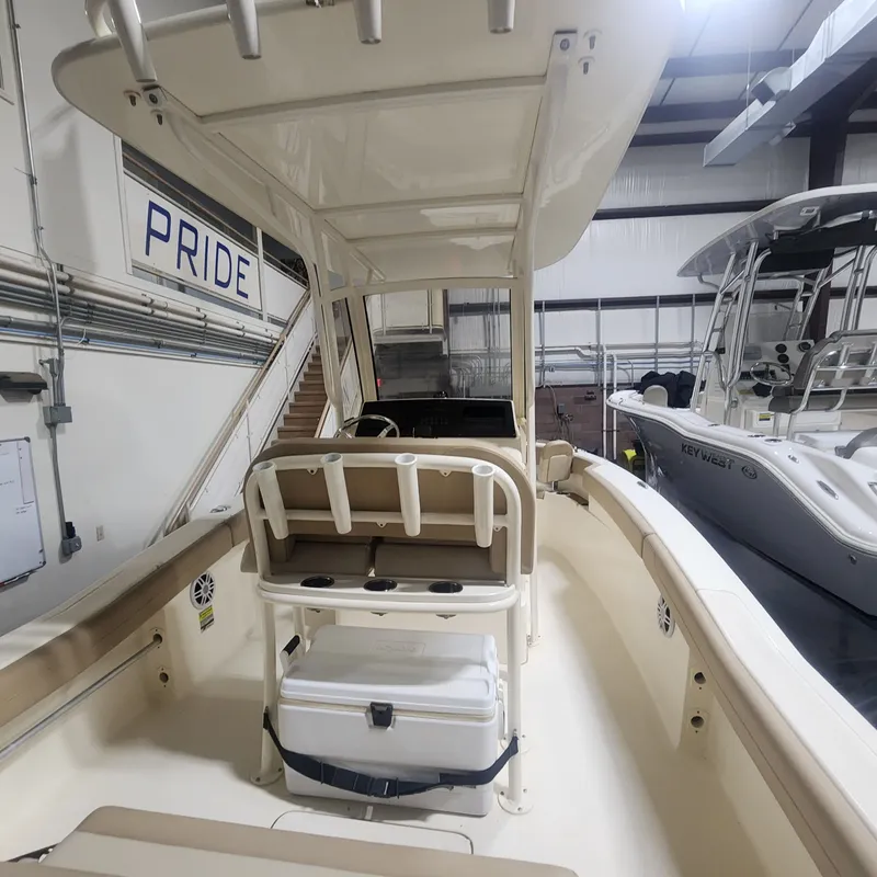 Slide: The Image of Interior view of 2023 Scout 215 XSF boat in a storage facility. - 18