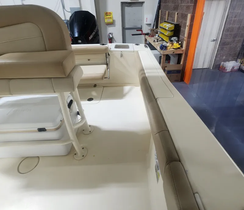 Slide: The Image of Interior of a 2023 Scout 215 XSF boat with seating area. - 20