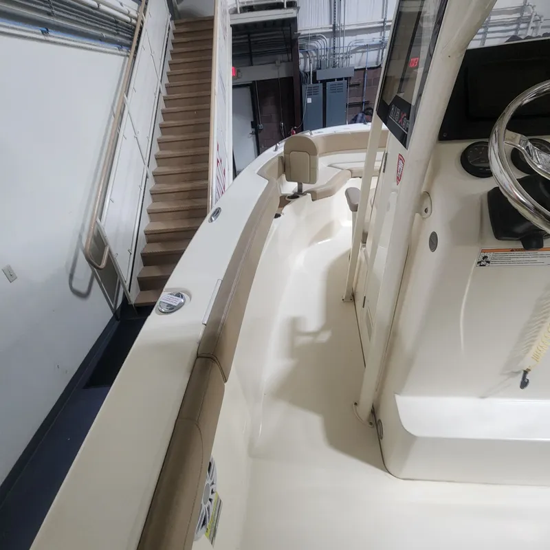 Slide: The Image of Interior view of a 2023 Scout 215 XSF boat in storage. - 24