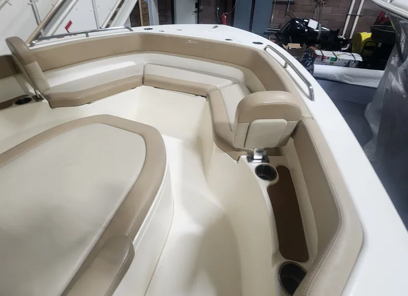 Slide: The Image of Interior view of 2023 Scout 215 XSF boat with beige seating. - 28