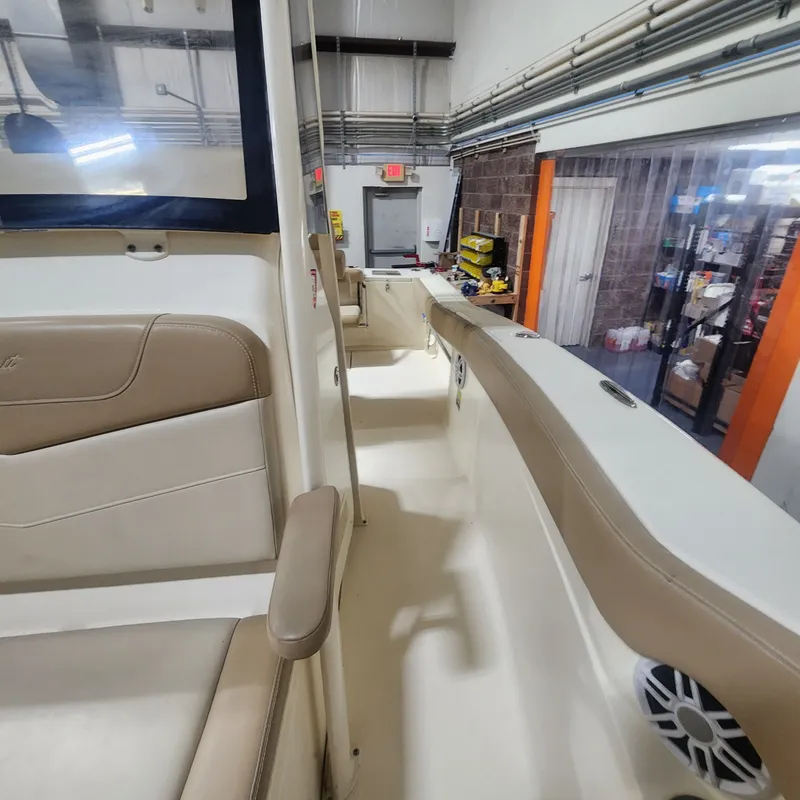 Slide: The Image of Interior of a 2023 Scout 215 XSF boat in a workshop. - 30