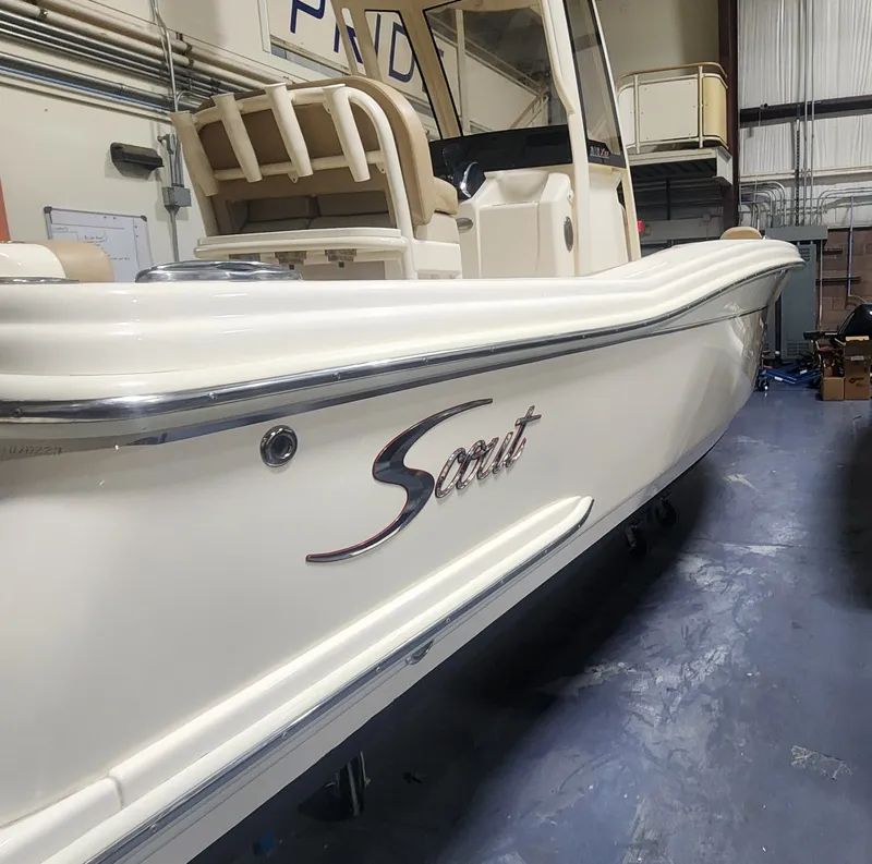 Slide: The Image of 2023 Scout 215 XSF boat in a workshop. - 9
