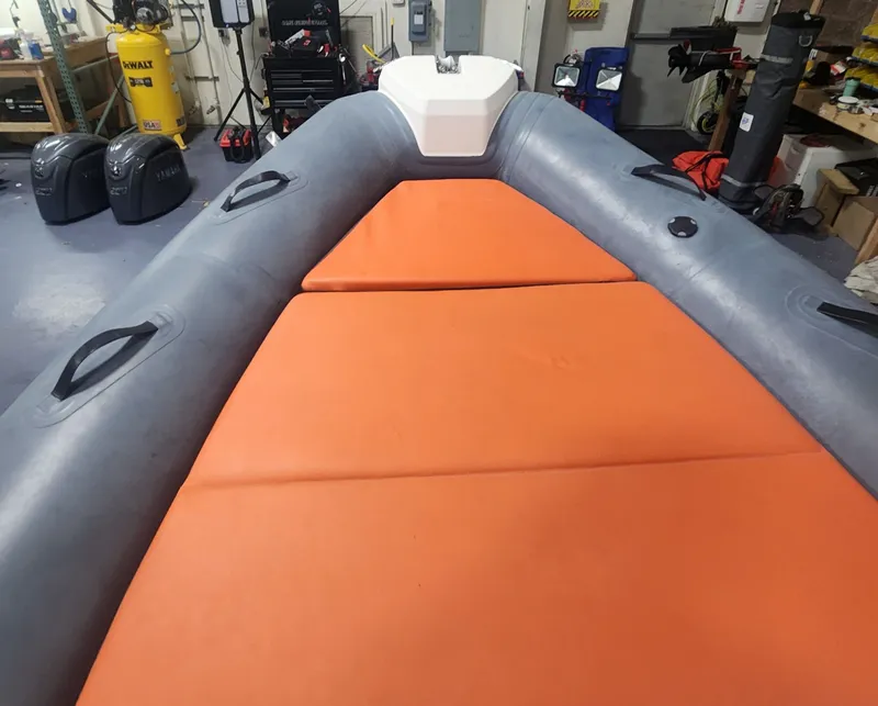 Slide: The Image of 2024 Zodiac Medline 6.8 with orange cushions in workshop. - 11