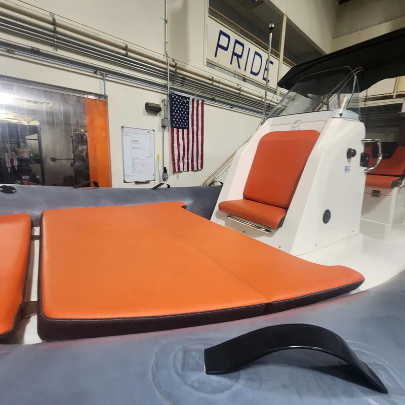 Slide: The Image of 2024 Zodiac Medline 6.8 with orange seats in a workshop. - 12