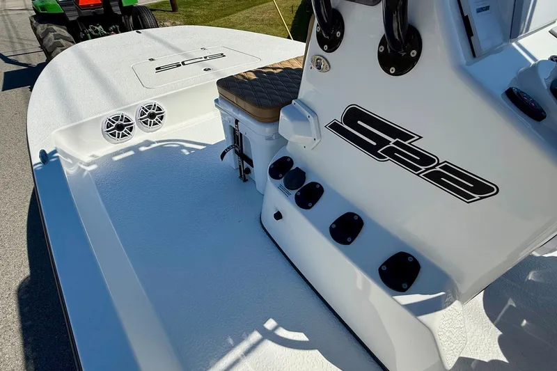 Slide: The Image of 2024 SCB S22 boat deck with speakers and seating, showcasing sleek design. - 12