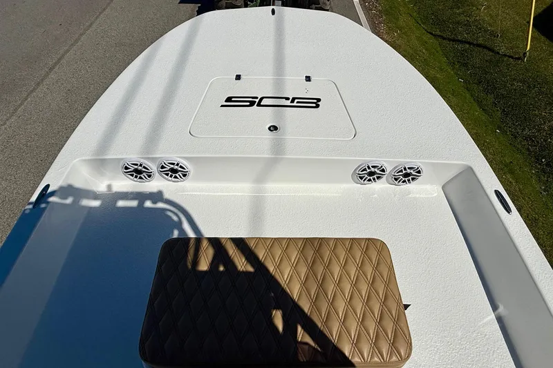 Slide: The Image of 2024 SCB S22 boat deck with speakers and cushioned seat. - 13