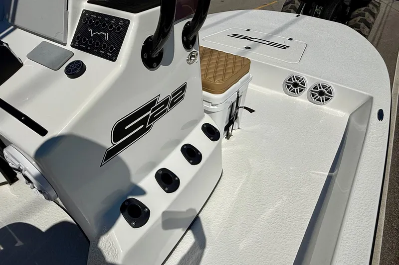 Slide: The Image of 2024 SCB S22 boat interior with console, seating, and speakers. - 14