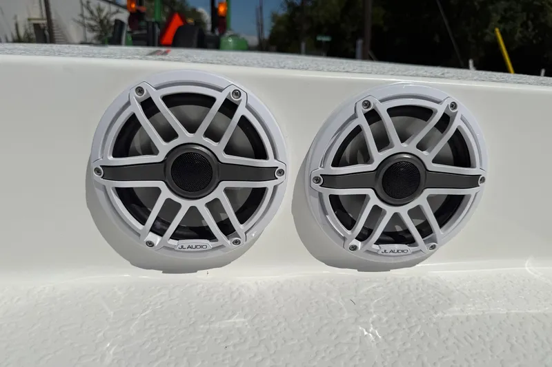 Slide: The Image of White JL Audio marine speakers on a 2024 SCB S22 boat. - 17