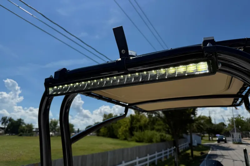 Slide: The Image of 2024 SCB S22 boat with LED light bar under clear blue sky. - 18