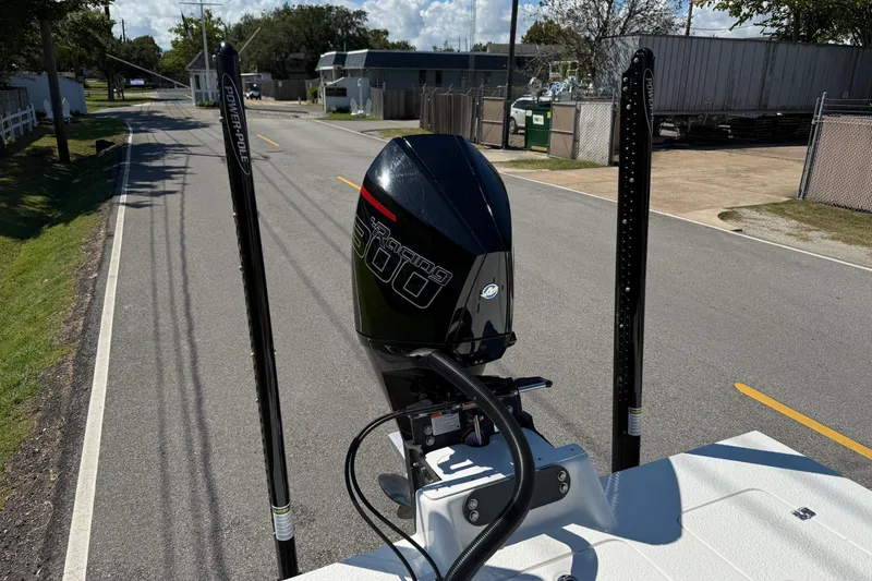 Slide: The Image of 2024 SCB S22 boat with Power-Pole anchors and outboard motor on a road. - 20