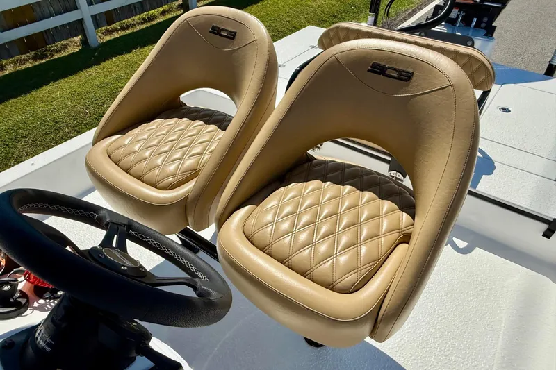 Slide: The Image of Luxurious tan leather seats in 2024 SCB S22 boat, featuring diamond stitching. - 9