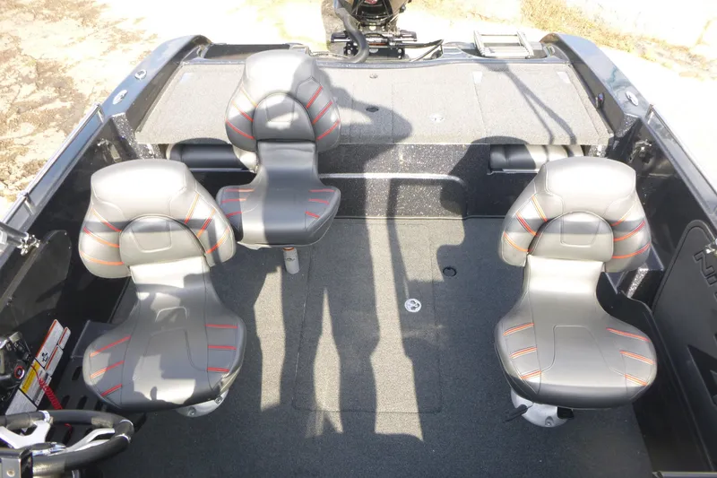 Slide: The Image of 2023 Nitro ZV19 Sport Pro boat interior with four gray seats and carpeted flooring. - 11