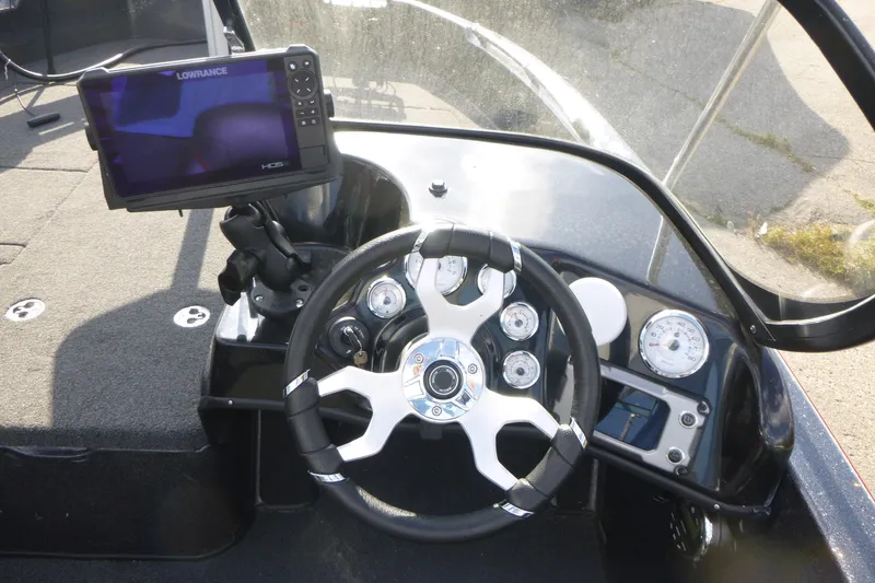 Slide: The Image of 2023 Nitro ZV19 Sport Pro dashboard with steering wheel and Lowrance HDS display. - 13