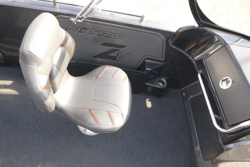 Slide: The Image of 2023 Nitro ZV19 Sport Pro boat interior with cushioned seat and sleek design. - 14
