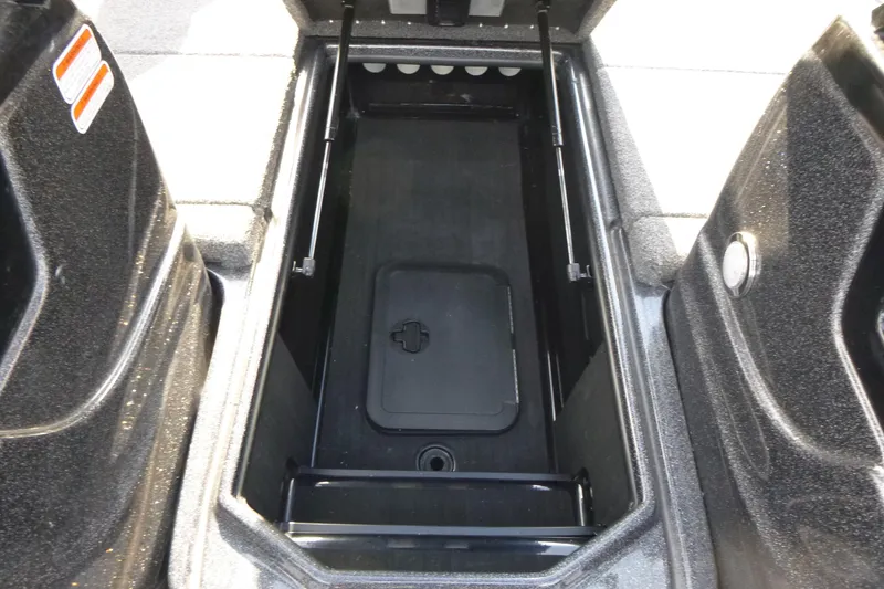 Slide: The Image of 2023 Nitro ZV19 Sport Pro storage compartment with open lid, showcasing interior space. - 15