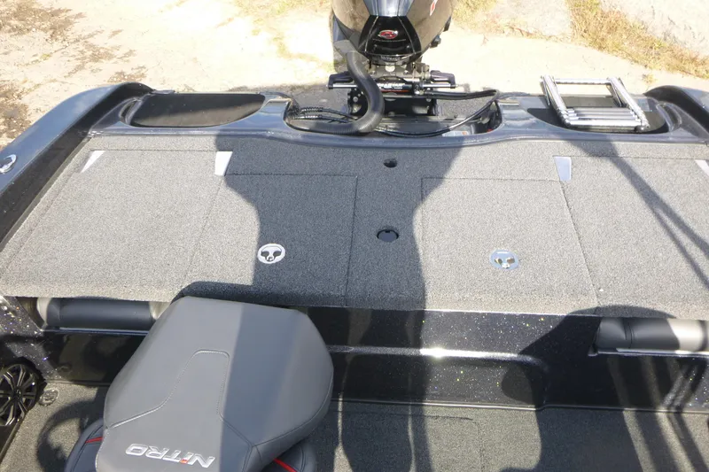 Slide: The Image of 2023 Nitro ZV19 Sport Pro boat interior with motor and seating. - 16