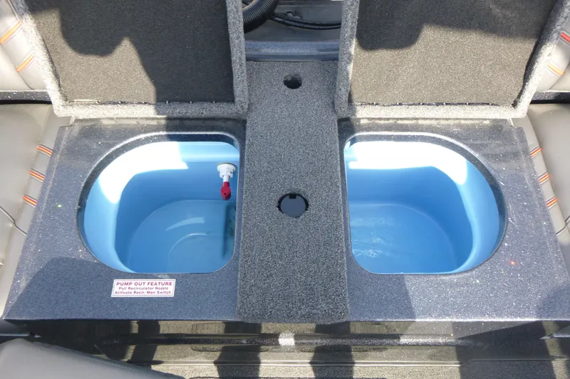Slide: The Image of 2023 Nitro ZV19 Sport Pro livewell compartments with pump-out feature. - 18