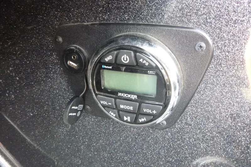 Slide: The Image of 2023 Nitro ZV19 Sport Pro audio control panel with Kicker stereo system. - 19