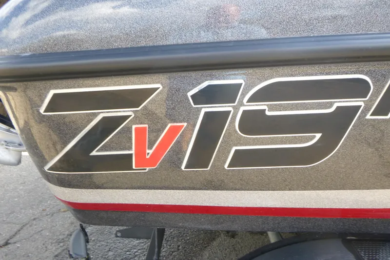 Slide: The Image of 2023 Nitro ZV19 Sport Pro boat logo on metallic surface. - 21