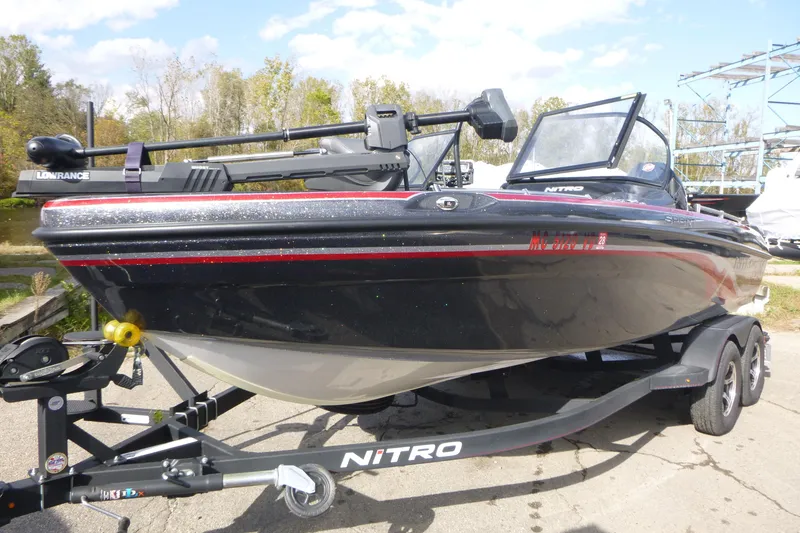 Slide: The Image of 2023 Nitro ZV19 Sport Pro boat on trailer, featuring sleek black design and Lowrance equipment. - 3