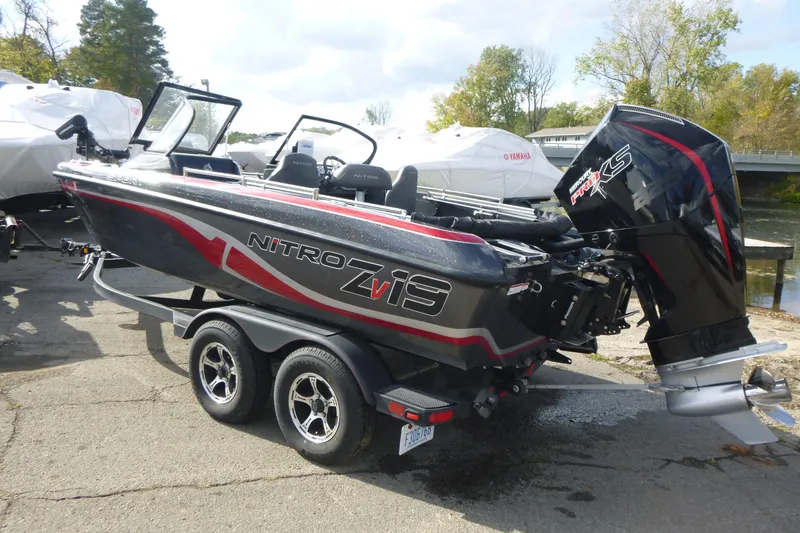 Slide: The Image of 2023 Nitro ZV19 Sport Pro boat on trailer, featuring sleek design and powerful engine. - 4