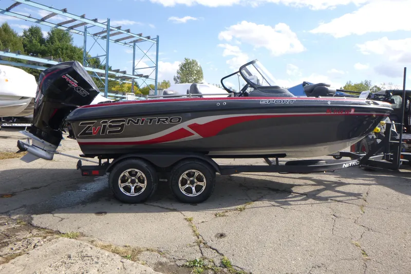 Slide: The Image of 2023 Nitro ZV19 Sport Pro boat on trailer, outdoors, under blue sky. - 5