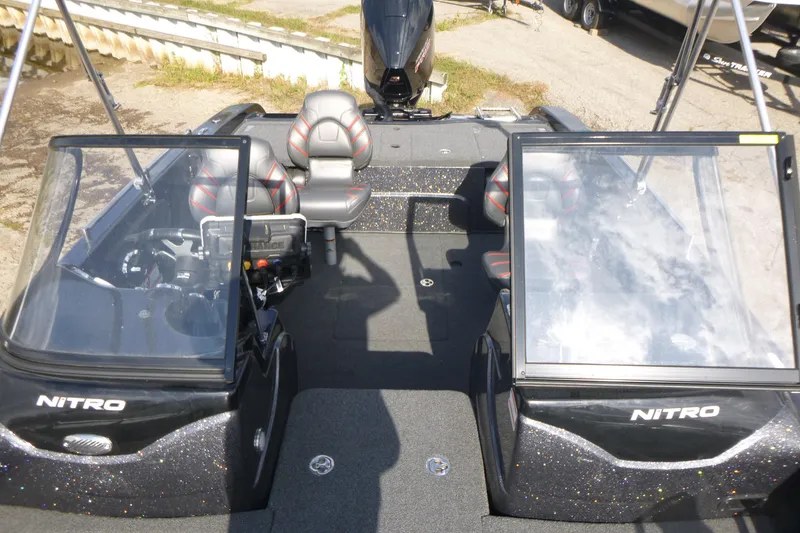 Slide: The Image of 2023 Nitro ZV19 Sport Pro boat interior with dual consoles and seating. - 7
