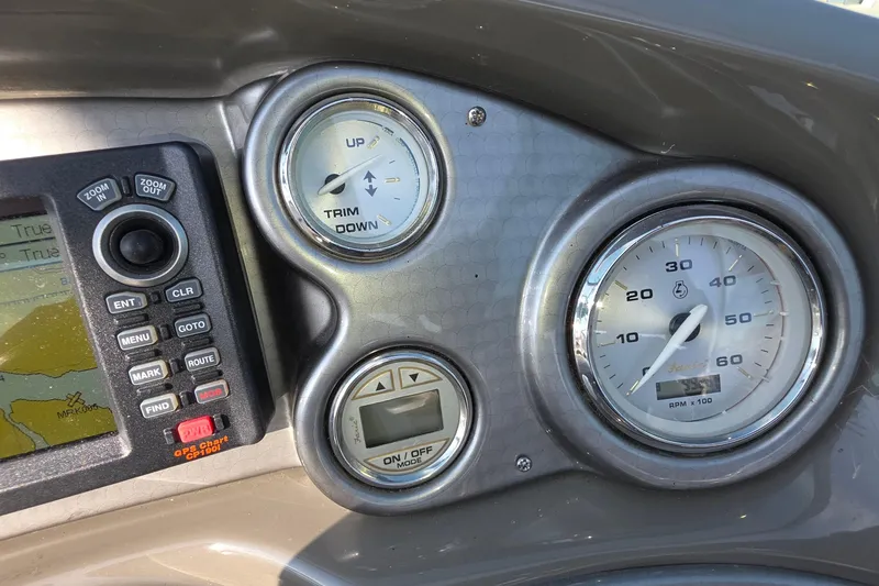 Slide: The Image of Dashboard of 2013 Rinker 276 Captiva Bowrider with gauges and GPS display. - 12