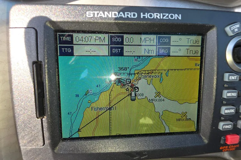 Slide: The Image of GPS navigation screen on a 2013 Rinker 276 Captiva Bowrider, showing Charlevoix area map. - 13
