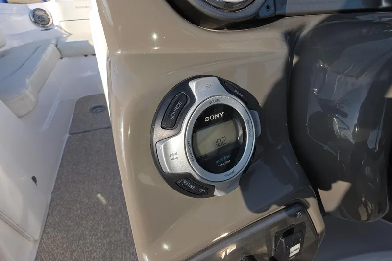 Slide: The Image of Sony marine stereo system on 2013 Rinker 276 Captiva Bowrider boat dashboard. - 28