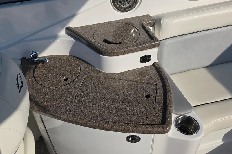 Slide: The Image of 2013 Rinker 276 Captiva Bowrider interior with sink and seating area. - 32