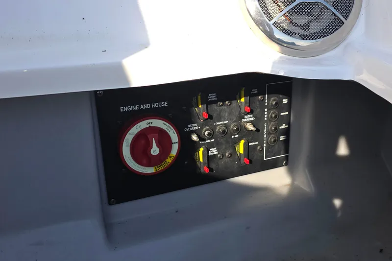 Slide: The Image of Control panel of 2013 Rinker 276 Captiva Bowrider boat, featuring engine and house switches. - 34