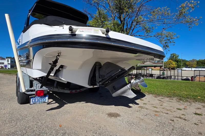 Slide: The Image of 2013 Rinker 276 Captiva Bowrider on trailer, rear view with propeller visible. - 5