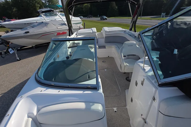 Slide: The Image of 2013 Rinker 276 Captiva Bowrider with spacious seating and sleek design. - 7