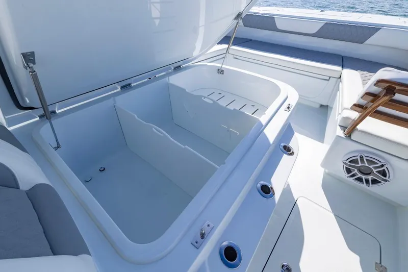 Slide: The Image of Open storage compartment on 2026 Invincible 46 Catamaran, featuring sleek design and spacious interior. - 21