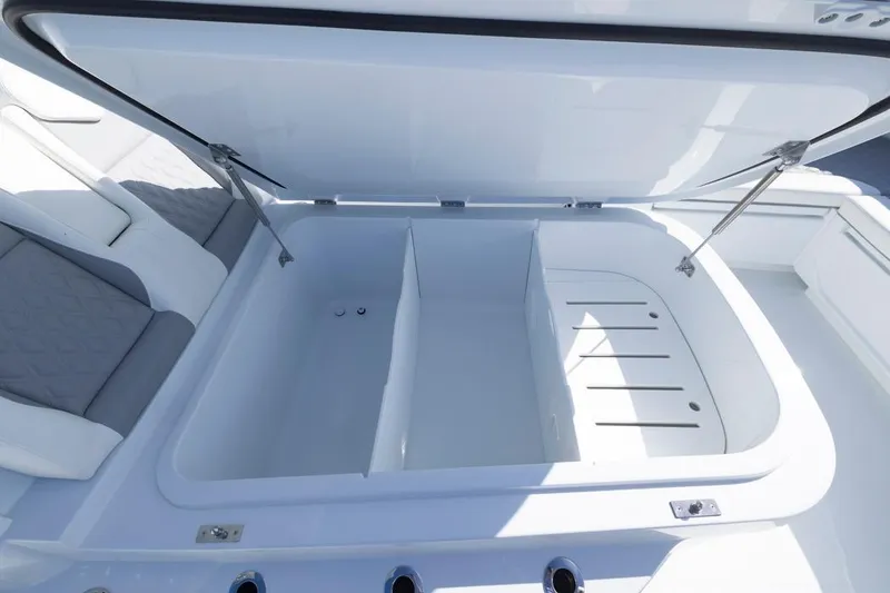 Slide: The Image of Open storage compartment on 2026 Invincible 46 Catamaran, featuring spacious interior and sleek design. - 22