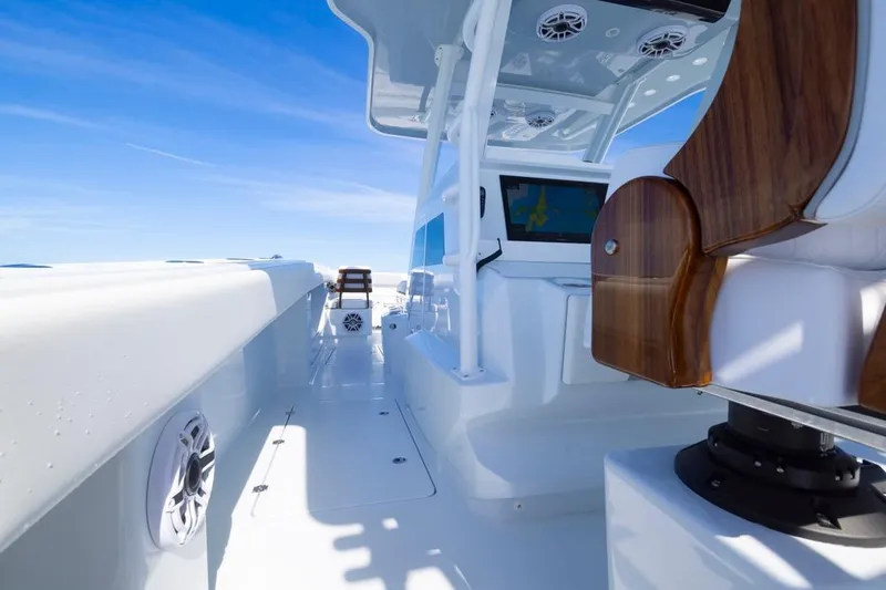 Slide: The Image of 2026 Invincible 46 Catamaran deck with modern seating and navigation system. - 39