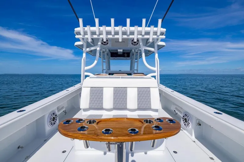 Slide: The Image of 2026 Invincible 46 Catamaran on open sea, showcasing sleek design and spacious deck. - 48