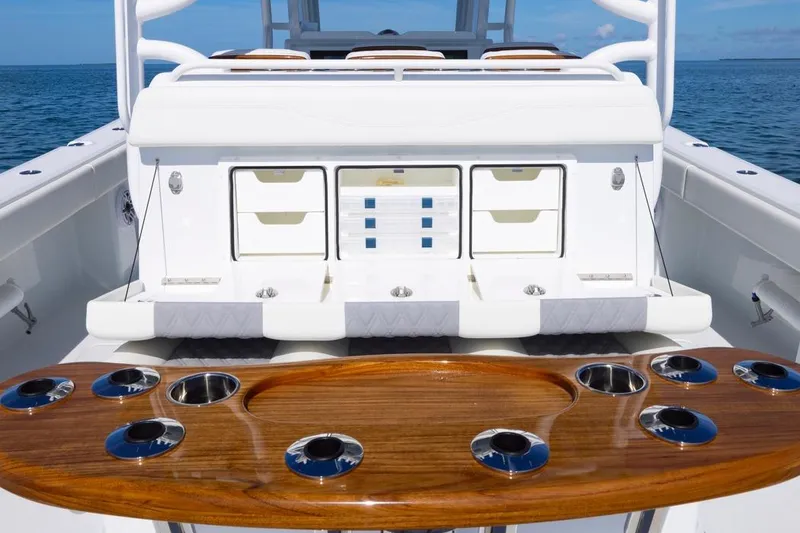 Slide: The Image of 2026 Invincible 46 Catamaran fishing station with rod holders and storage drawers. - 49