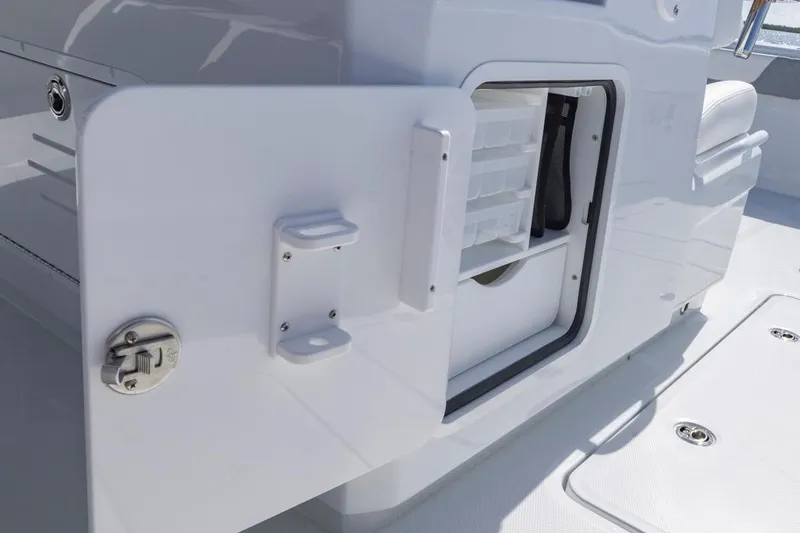 Slide: The Image of Open storage compartment on 2026 Invincible 46 Catamaran, showcasing organized interior space. - 51