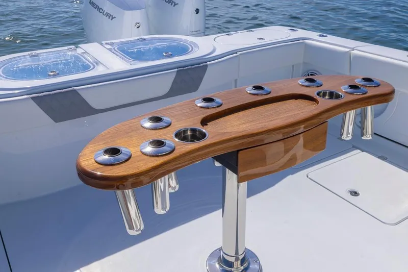 Slide: The Image of Luxury fishing station on 2026 Invincible 46 Catamaran with rod holders and livewell. - 53